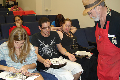 Maestro Martorell observes the artistic work in progress from various workshop participants.