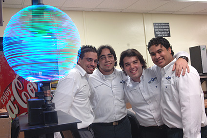 Edward Betancourt, Rogelio Cardona, Ramón González and Willie González work on the project named Sword, a flashing sphere of lights that displays 3D images.