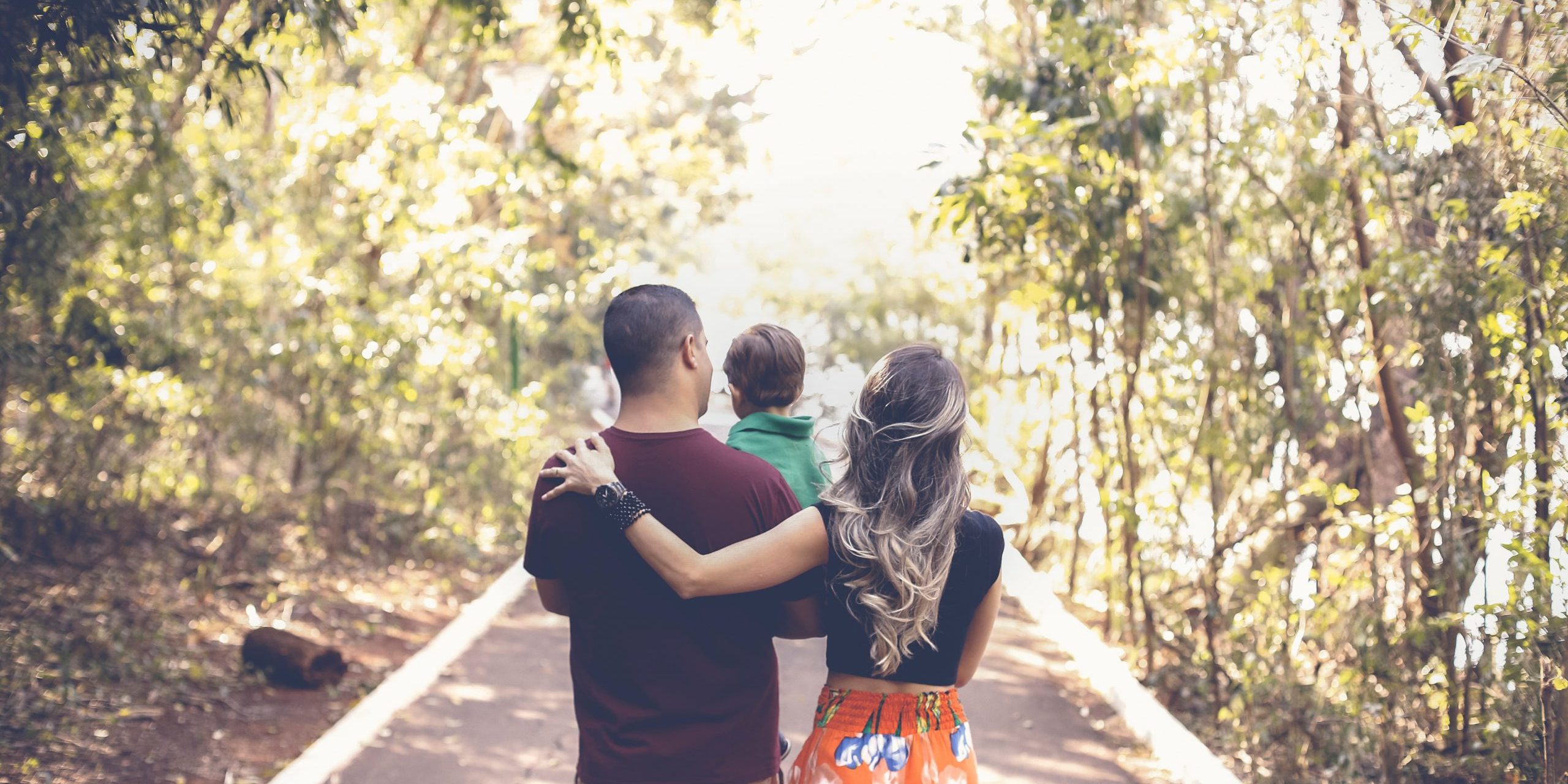 photo-of-family-walking-on-park-2880897