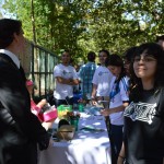 Students present at an info table for one of the organizations of the English Department during the Open House.