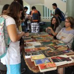 This table shows the book side of the EDSA Book & Bake Sale. Books are presented along with price tags for anyone who is interested.