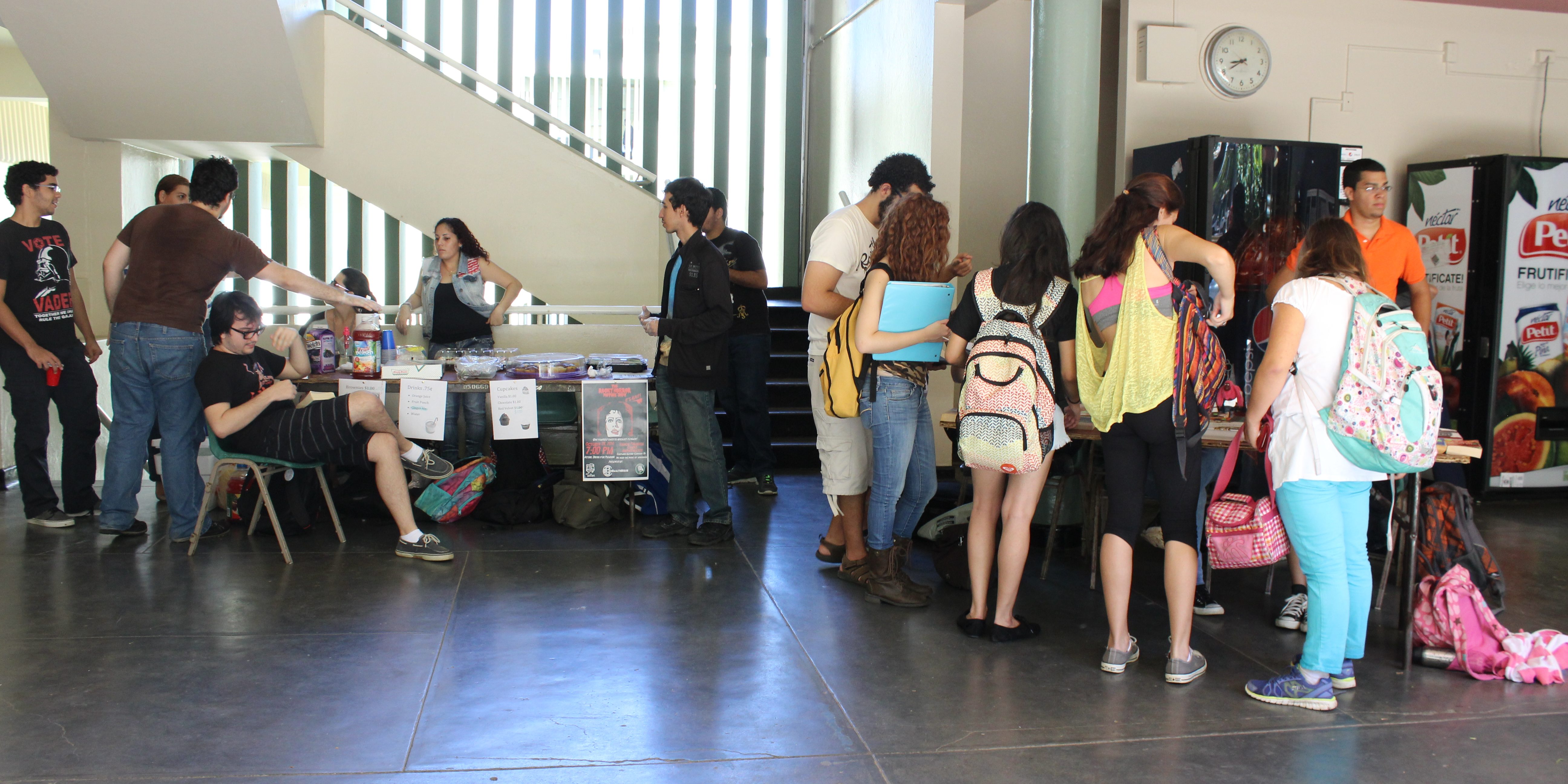 IMG_4676 A panoramic shot of the Chardon Lobby during the EDSA Book & Bake Sale. Even though it is covered by people, both tables are present in this picture. The one for the bake sale and the one for the book sale.