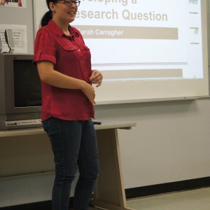 A student presenting material in front of the classroom at the Linguistics Colloquium 2015.