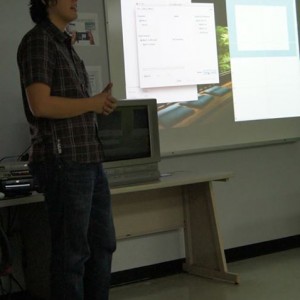 A student presenting material in front of the classroom at the Linguistics Colloquium 2015.