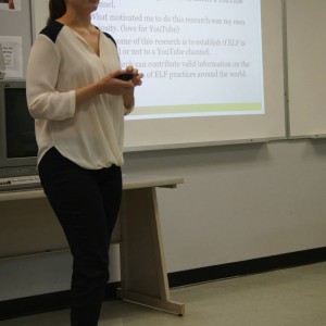 A student presenting material in front of the classroom at the Linguistics Colloquium 2015.