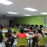 A room full of participants listening to a presentation during the Banned Book Week with EDSA.