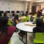 MAEE Candidate standing at the front, talking to a room full of students about what are banned books.