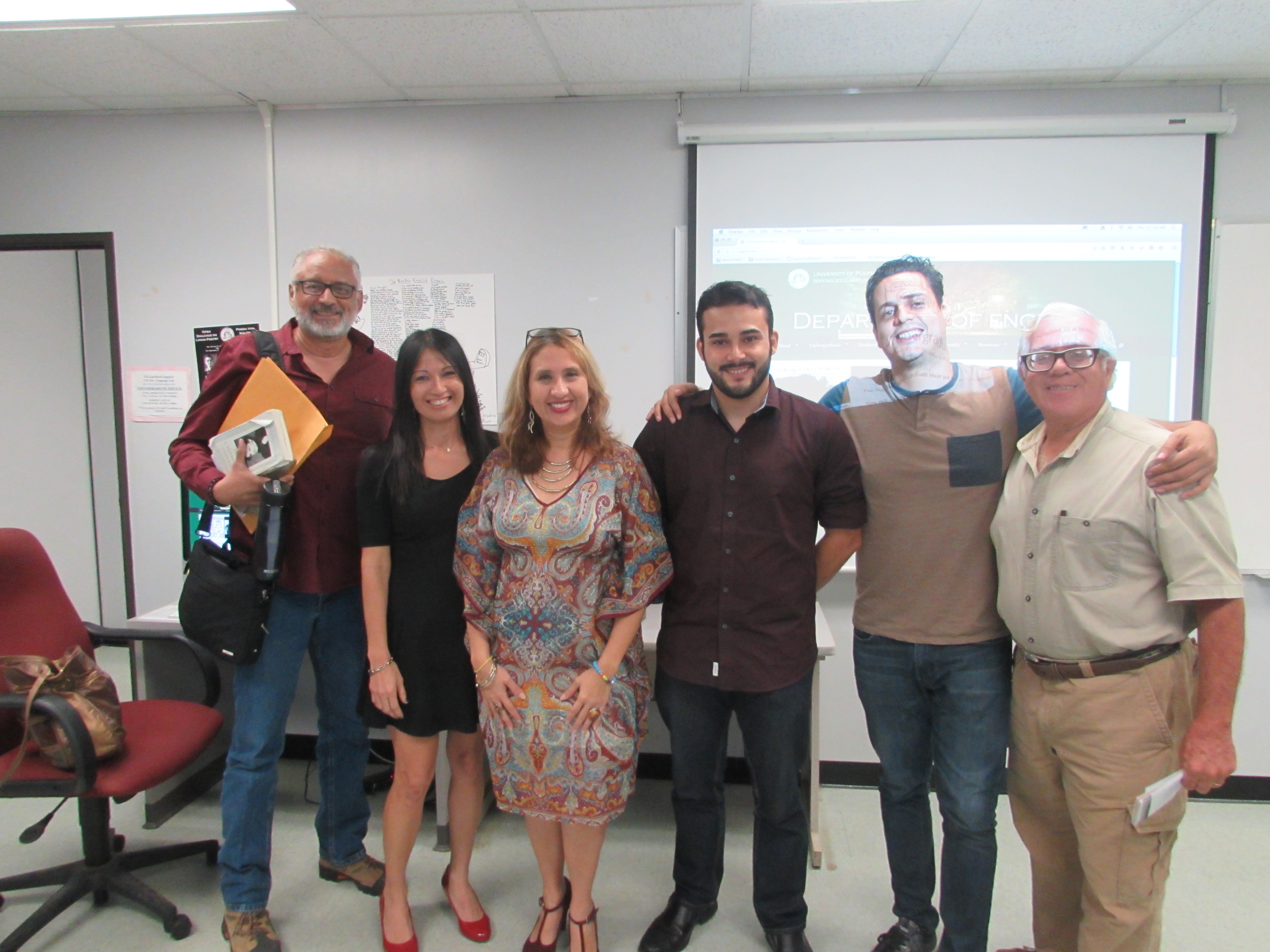 Faculty Advisors and well known college professors of the English Department posing for the camera.