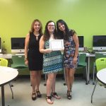 The Mellow's Award Recipient standing in the middle, accompanied by Nancy Vicente (left) and Rosita Rivera (right).