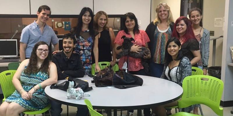 13232957_10154219316669686_7121704225736852281_n Faculty members and students all posing for the camera. This picture is closer still so you can see Dr. Betsy Morales holding up her dog.