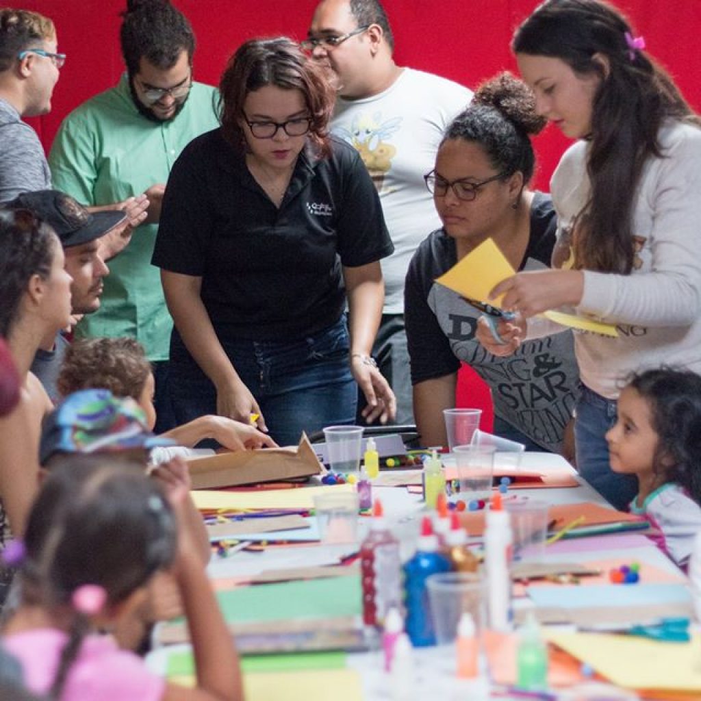 EDSA members looking at children and other members working on the crafts.