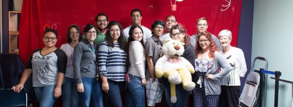 Several EDSA members posing for the camera and smiling. One of them is holding a big plush toy.