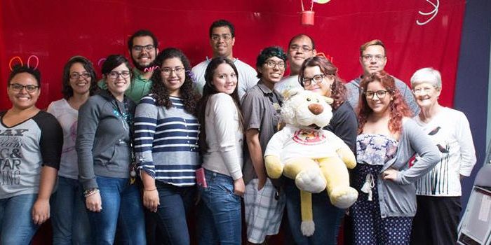 Several EDSA members posing for the camera and smiling. One of them is holding a big plush toy.