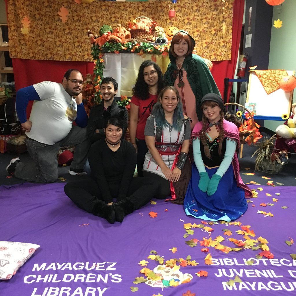 EDSA members posing for the camera. Some of them are wearing costumes and their surroundings is decorated with Halloween Themed decorations.