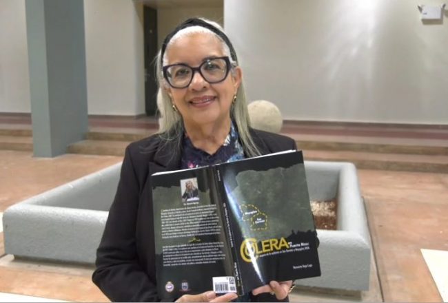 La doctora Ramonita Vega Lugo presentó su publicación Cólera en Puerto Rico: Impacto de la epidemia en San Germán y Mayagüez, 1856. Fotocaptura Alexander Machado Martínez/Prensa RUM. La doctora Ramonita Vega Lugo presentó su publicación Cólera en Puerto Rico: Impacto de la epidemia en San Germán y Mayagüez, 1856. Fotocaptura Alexander Machado Martínez/Prensa RUM.