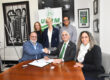 Representantes del RUM y la compañía LIFT durante la firma del acuerdo de colaboración en el área de la manufactura para el campo de aeroespacial. En la foto, el CFO de LIFT, Víctor M. Claudio (sentado, primero a la izquierda), junto a los doctores Agustín Rullán Toro, Cristina D. Pomales García. De pie, en el mismo orden, los doctores Silvina Cancelos Mancini, Ingrid Y. Padilla Cestero y Ricky Valentín Rullán.