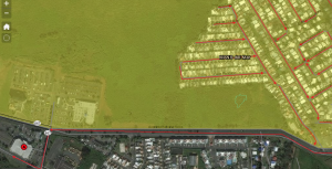 Satellite image of Mansion del Mar community and the surrounding area, overlayed with the yellow evacuation zone. The evacuation routes lead to an assembly point on the lower left of the image.