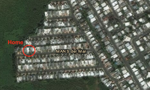 Satellite image of the Mansion del Mar community in Toa Baja. A house is circled in red with the label "home."