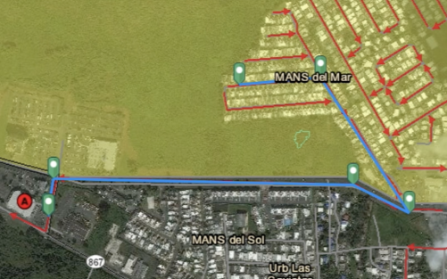 This is a screenshot of the interactive Map Tool using the measure tool to outline the evacuate route from a house in the Mansion del Mar community to the nearest assembly point, outside of the yellow evacuation zone.